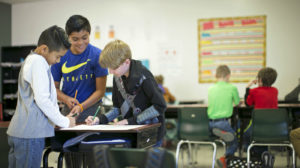 Middle schoolers at Beverly Hills Intermediate School in Pasadena, Texas collaborate during Summit Learning project time.